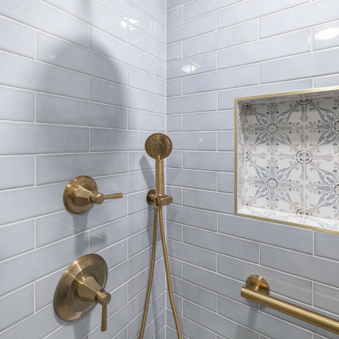 Brass shower fixtures with patterned tile niche