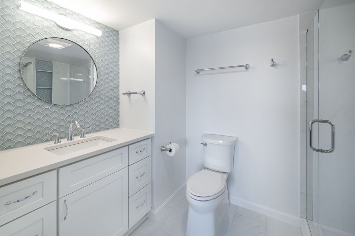 Modern white bathroom with vanity and toilet