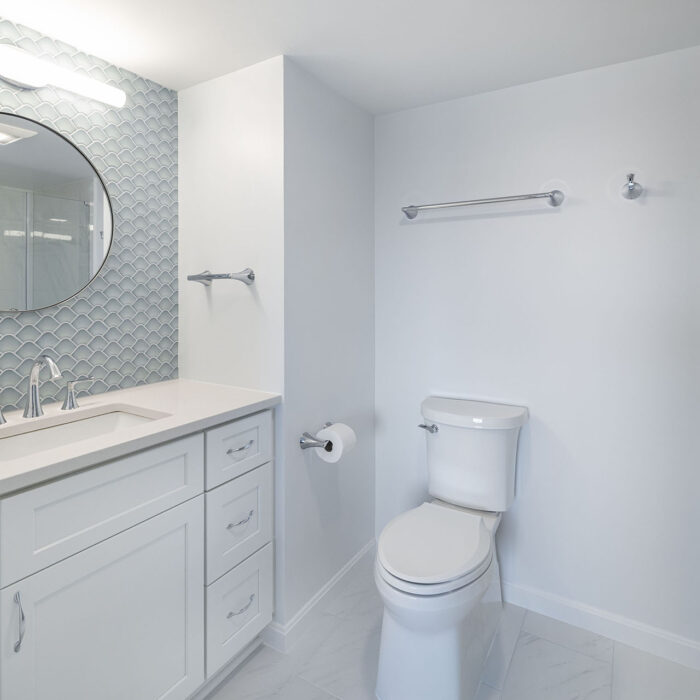 Modern white bathroom with vanity and toilet