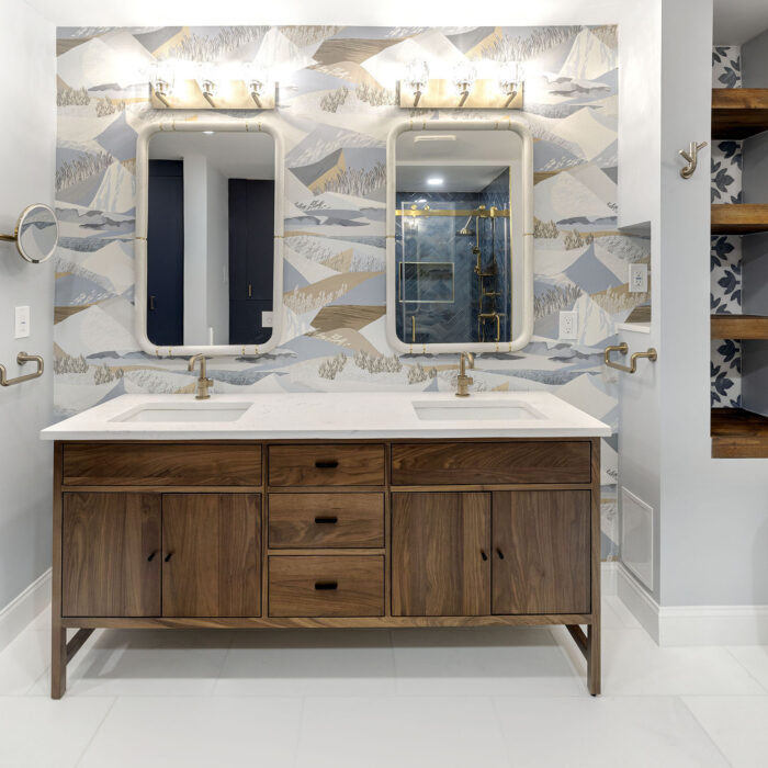 Double bathroom vanity with mirrors and wallpaper
