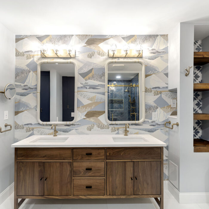 Double-sink bathroom vanity with patterned wallpaper