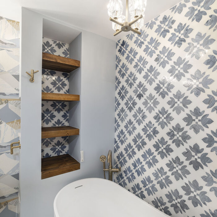 Bathroom with freestanding tub and floral tile