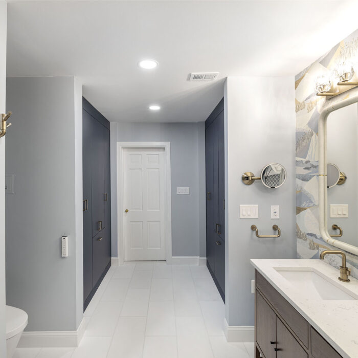 Modern bathroom with vanity, mirror, blue shower