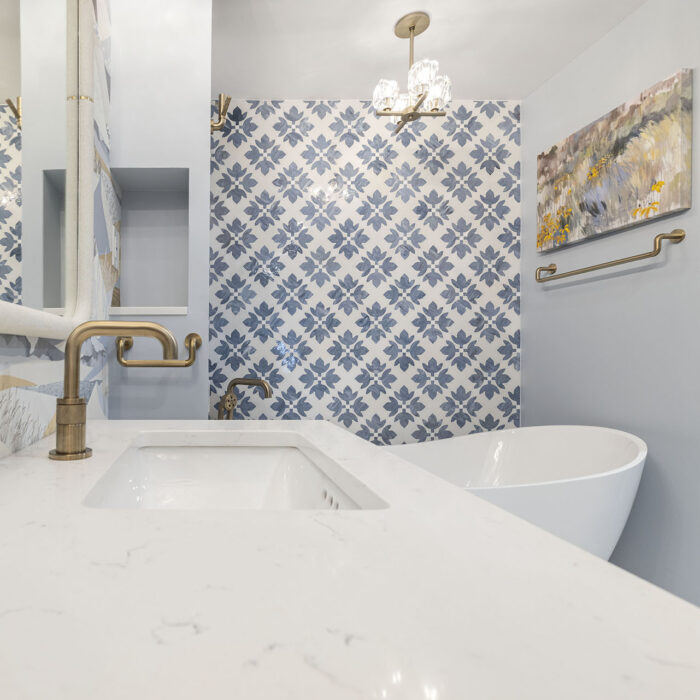 Modern bathroom with patterned tile and bathtub