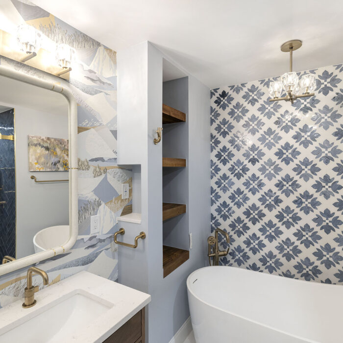 Modern bathroom with freestanding tub and patterned tiles