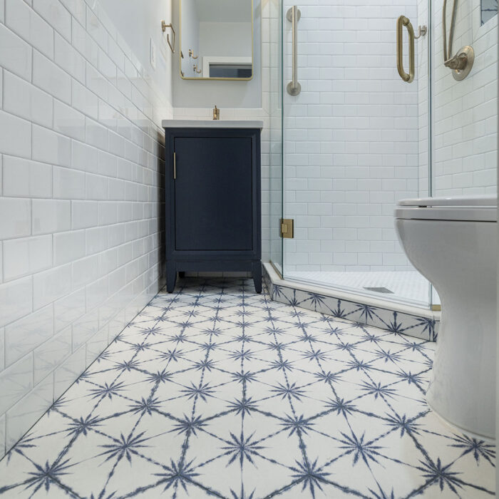 Bathroom with blue star-patterned tile floor