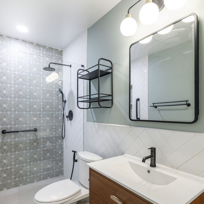 Modern bathroom with vanity, mirror, and shower