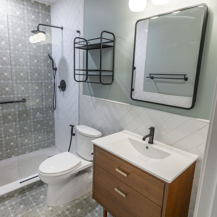 Modern bathroom with wooden vanity and shower