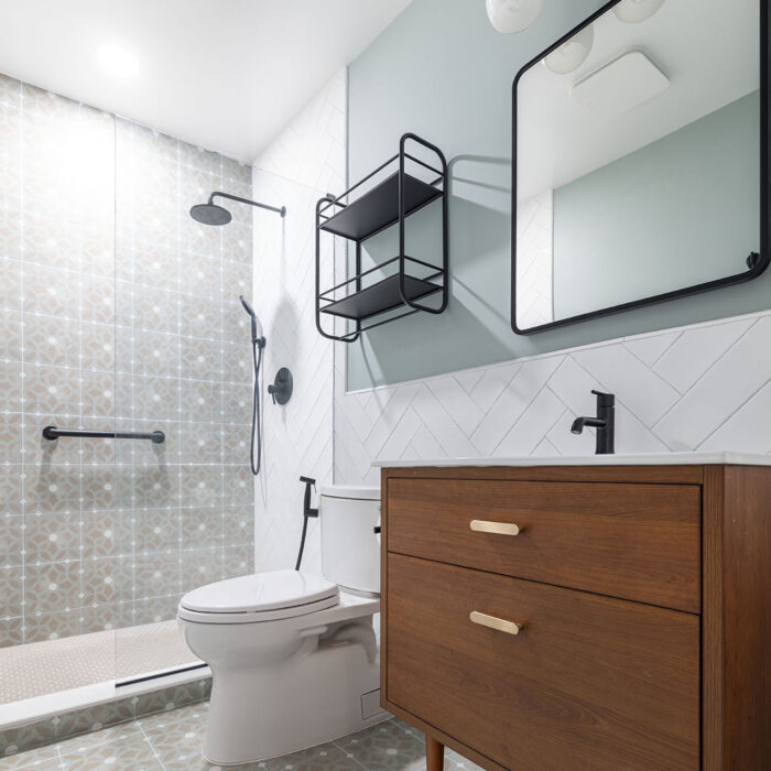 Modern bathroom with wooden vanity and black fixtures