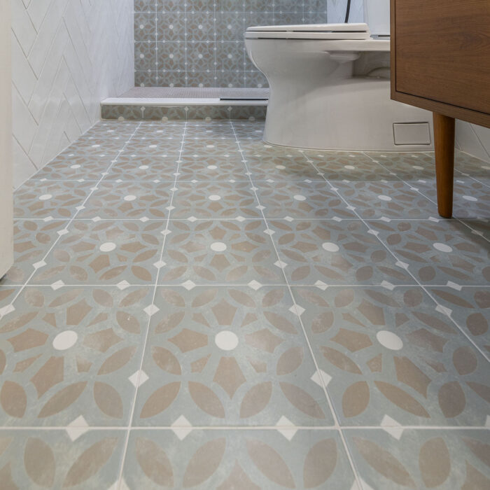Patterned tiled bathroom floor with toilet