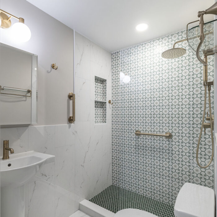 Modern accessible bathroom with patterned shower wall