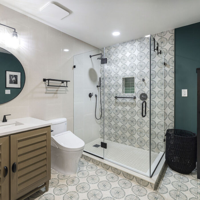 Modern bathroom with patterned tile and glass shower