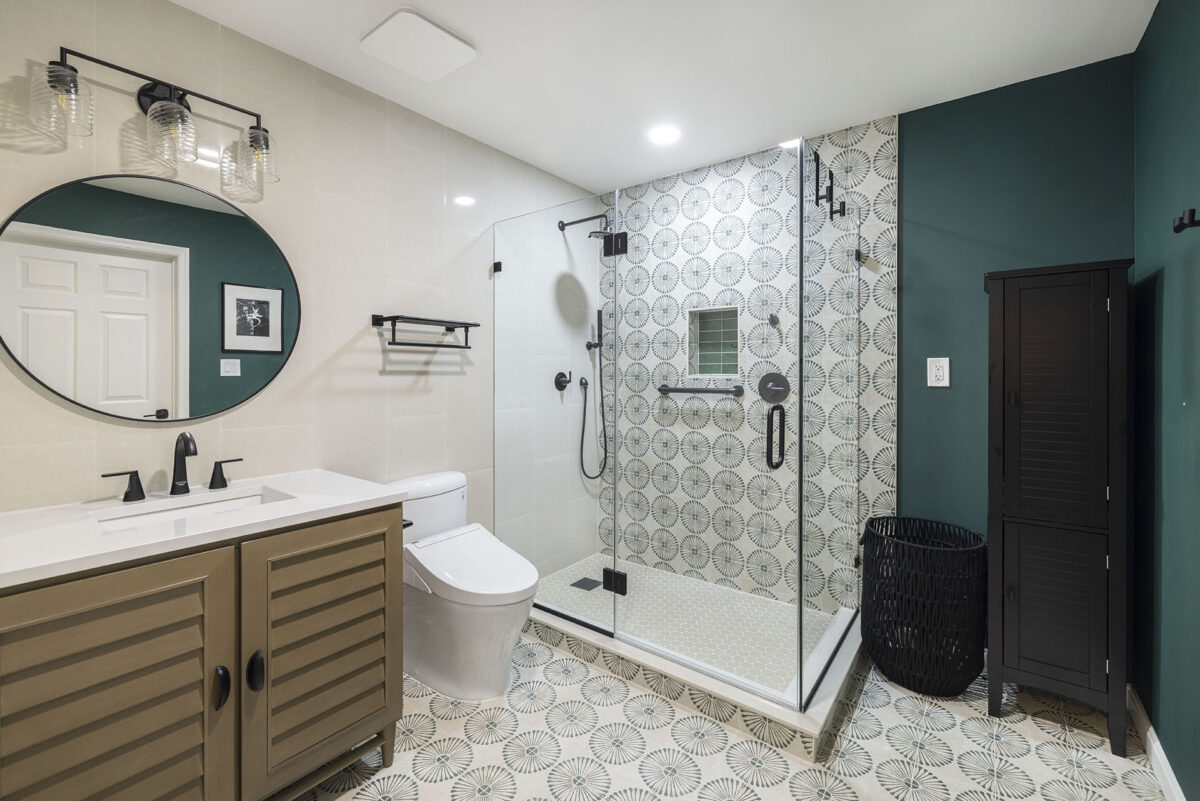 Modern bathroom with glass shower and patterned tiles