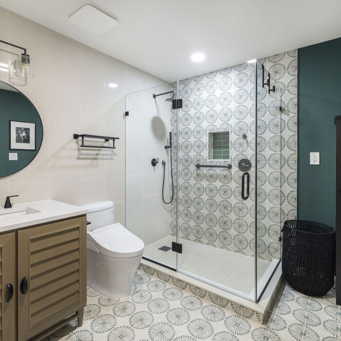 Modern bathroom with glass shower and patterned tiles