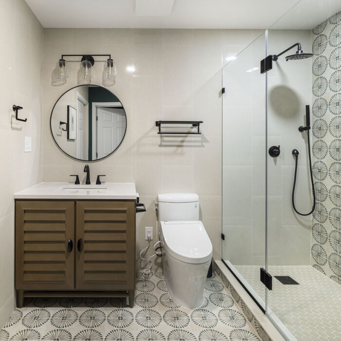 Modern bathroom with patterned tile and glass shower