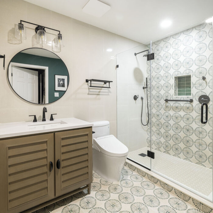 Modern bathroom with glass shower and patterned tiles