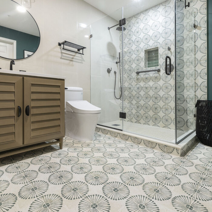 Modern bathroom with patterned tile floor and shower